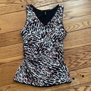 Reversible, black, and printed White House, Black market top